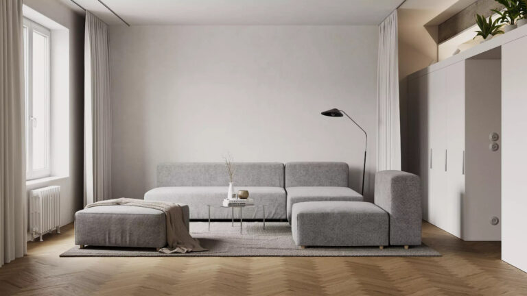 Salon z sofą modułową i podłogą w jodełkę